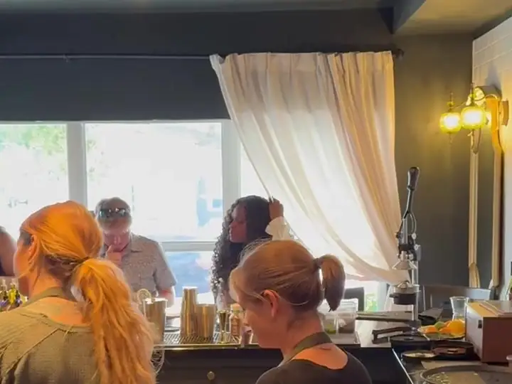 Guests gathered along the counter by the front windows